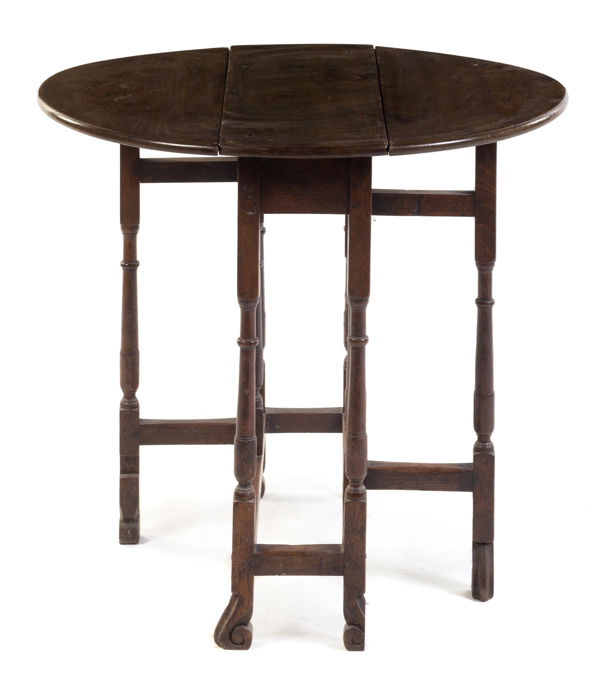 An English Oak Gate-Leg Table Height 28 1/4 x width 10 1/4 x depth 27 inches. — EARLY 20TH CENTURY