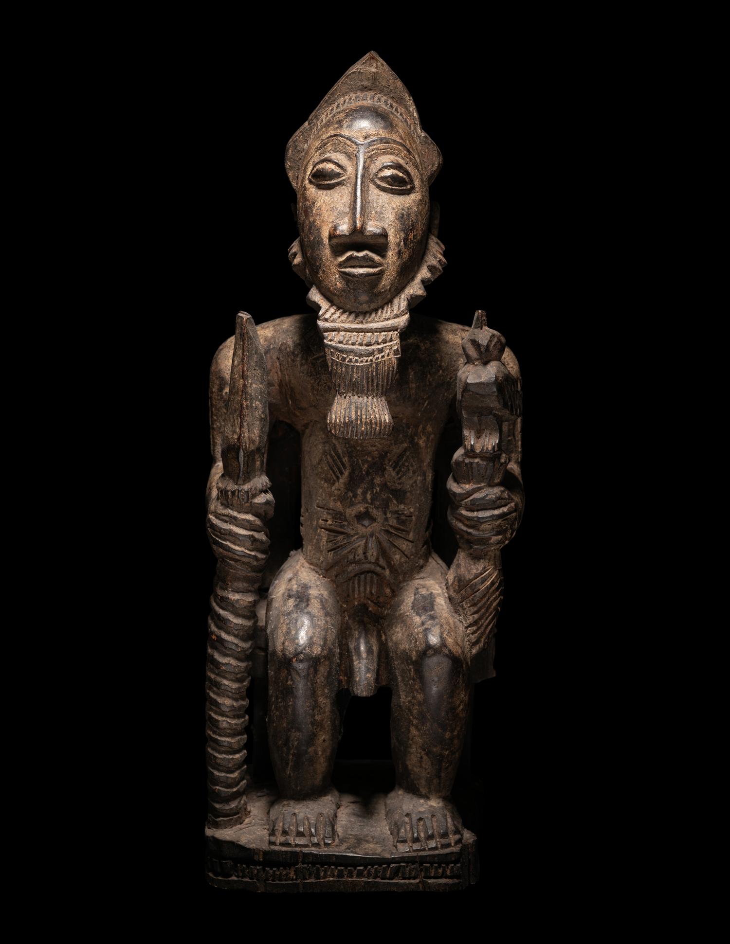 A Baule Wood Seated Male Figure