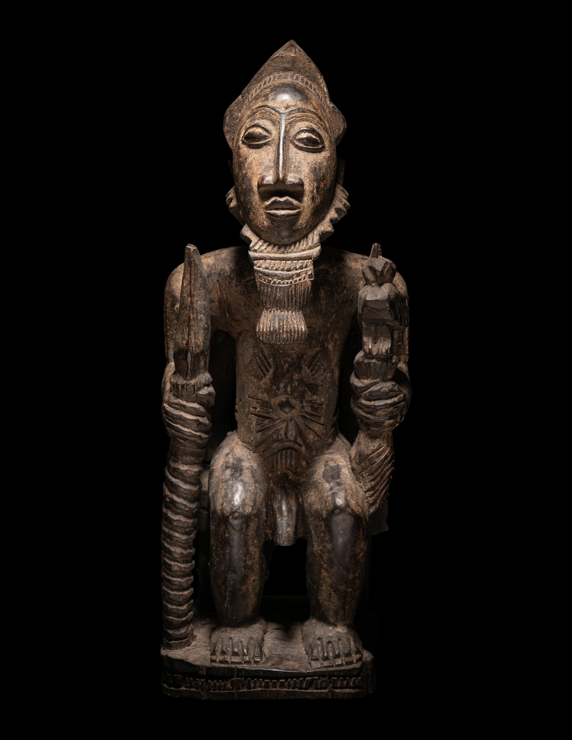 A Baule Wood Seated Male Figure