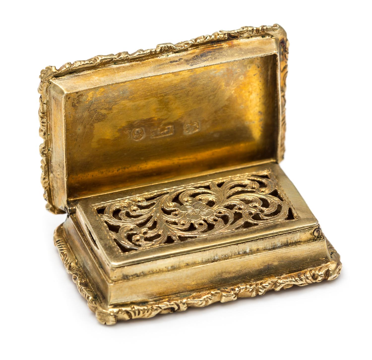 A William IV Silver-Gilt Vinaigrette, Maker's Mark E (pellet) J, Birmingham, the lid decorated with rocaille and C-scroll motifs center
