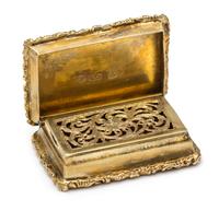 A William IV Silver-Gilt Vinaigrette, Maker's Mark E (pellet) J, Birmingham, the lid decorated with rocaille and C-scroll motifs center