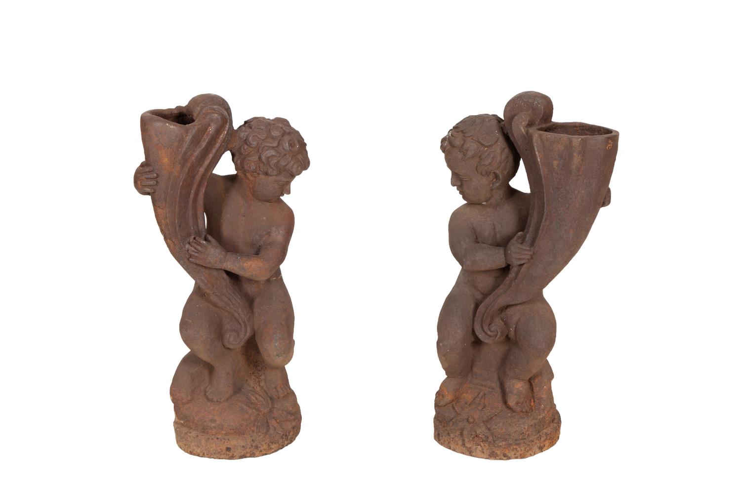 A Pair of Cast Iron Garden Cherubs