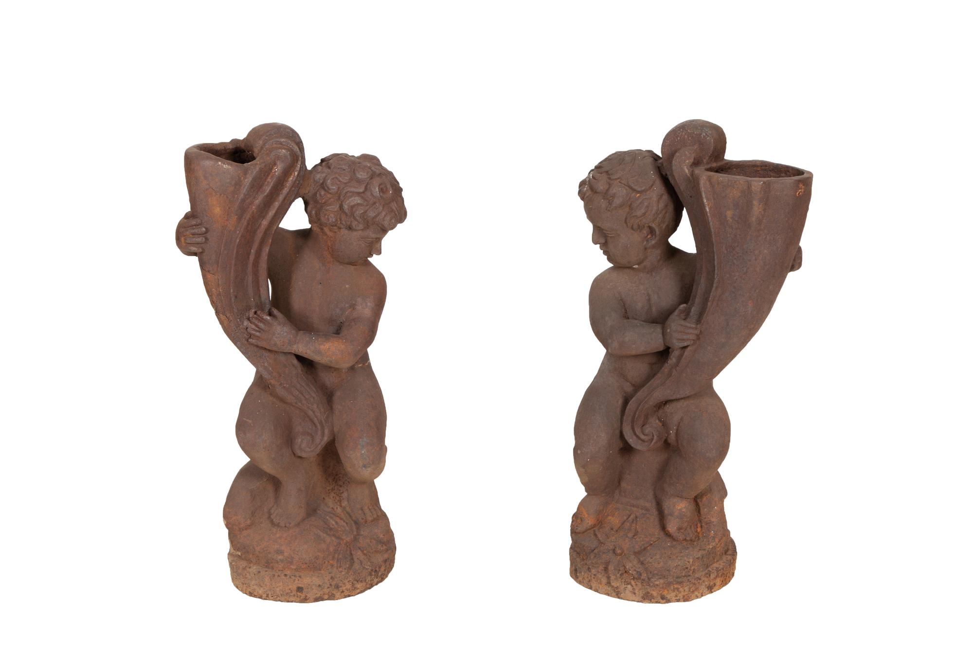 A Pair of Cast Iron Garden Cherubs