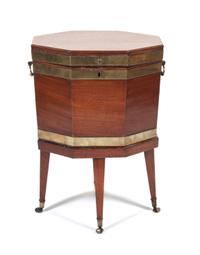 A George III Brass-bound Mahogany Cellarette Height 24 1/2 x width 17 1/2 x depth 17 1/2 inches.