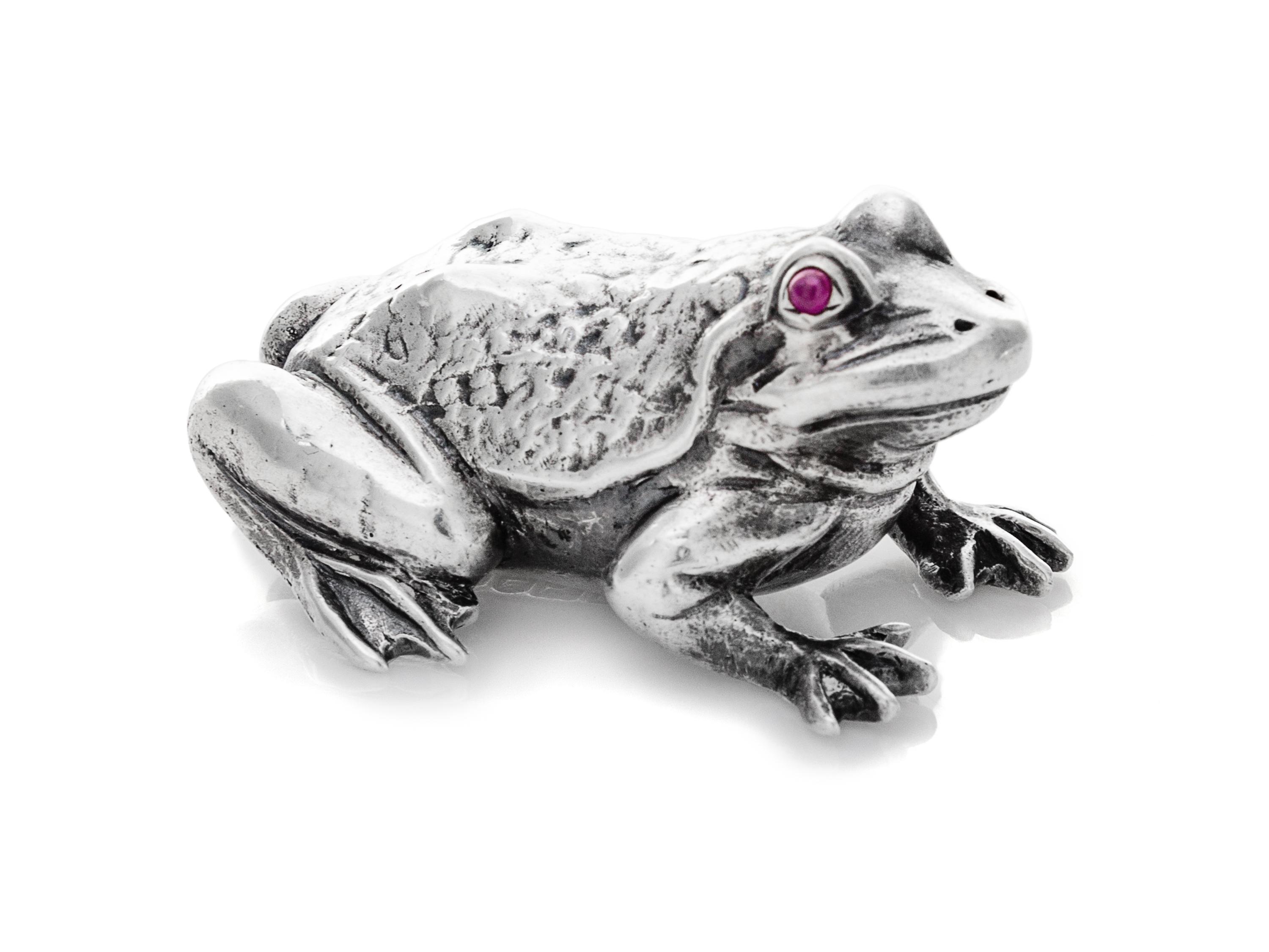 An Edwardian Silver Zoomorphic Figure, Harold Child, London, 1908, of a frog with hardstone cabochon inset eyes.