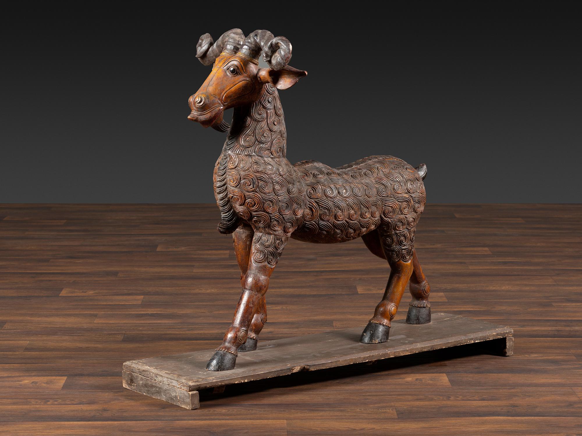 A Folk Art Carved and Painted Wood Ram
