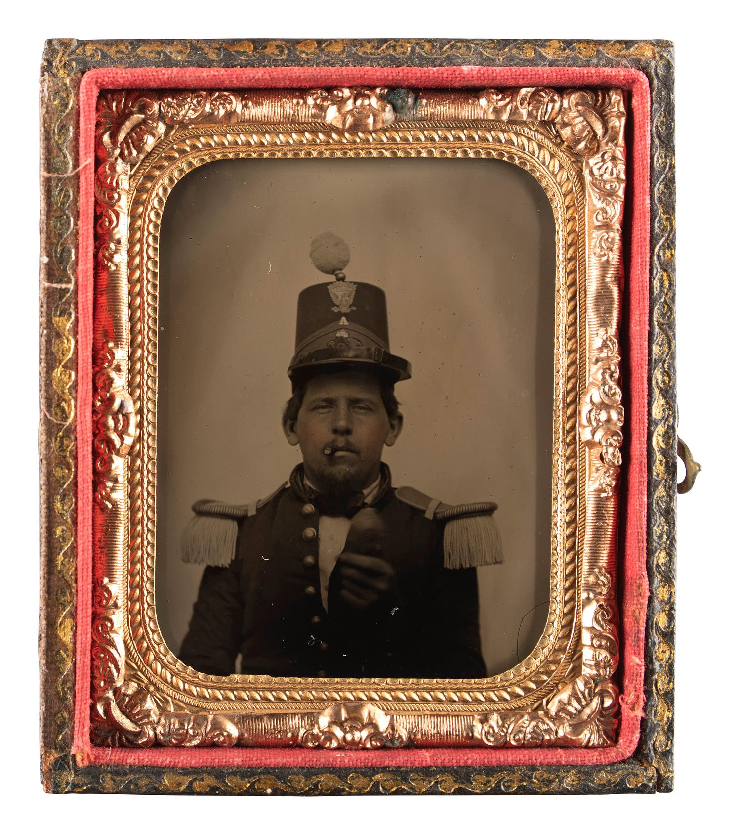 [MILITIA]. Ninth plate ruby ambrotype of a New England militiaman with a cheroot.