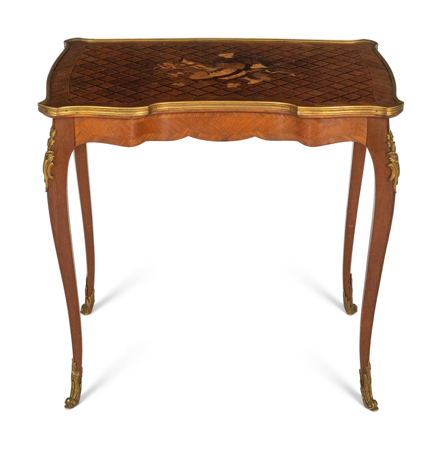 A Transitional Louis XV/XVI Gilt Bronze Mounted Marquetry Writing Table