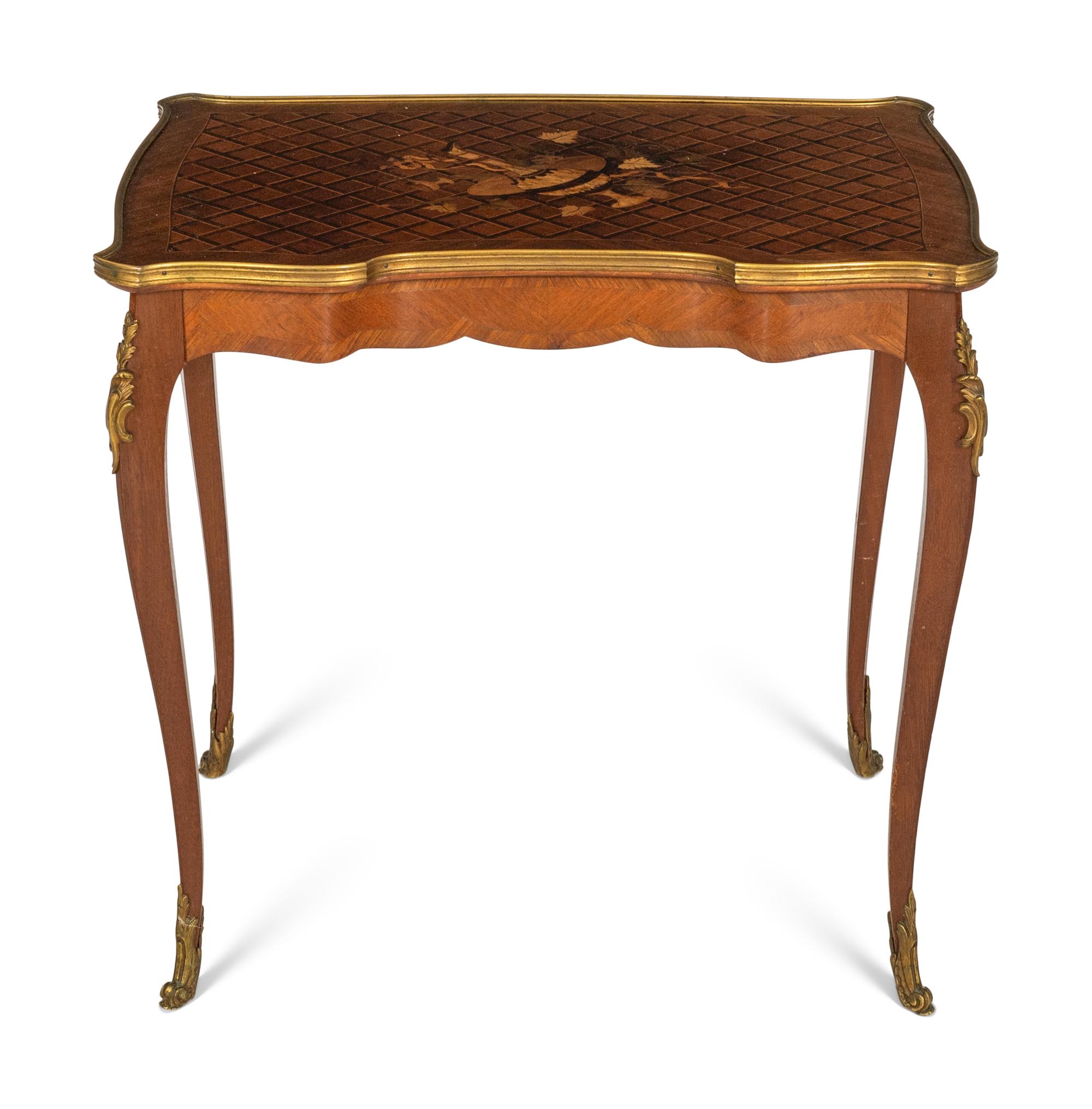 A Transitional Louis XV/XVI Gilt Bronze Mounted Marquetry Writing Table