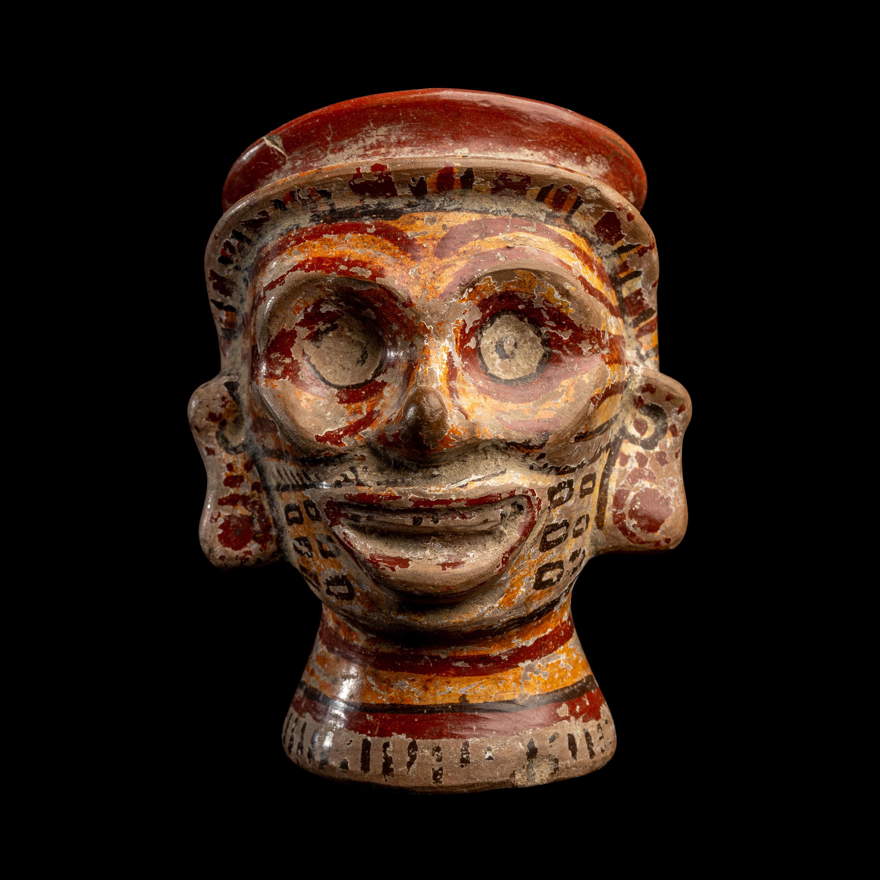A Mixtec Polychrome Vessel in the form of a Head