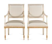 A Pair of Painted and Parcel Gilt Armchairs