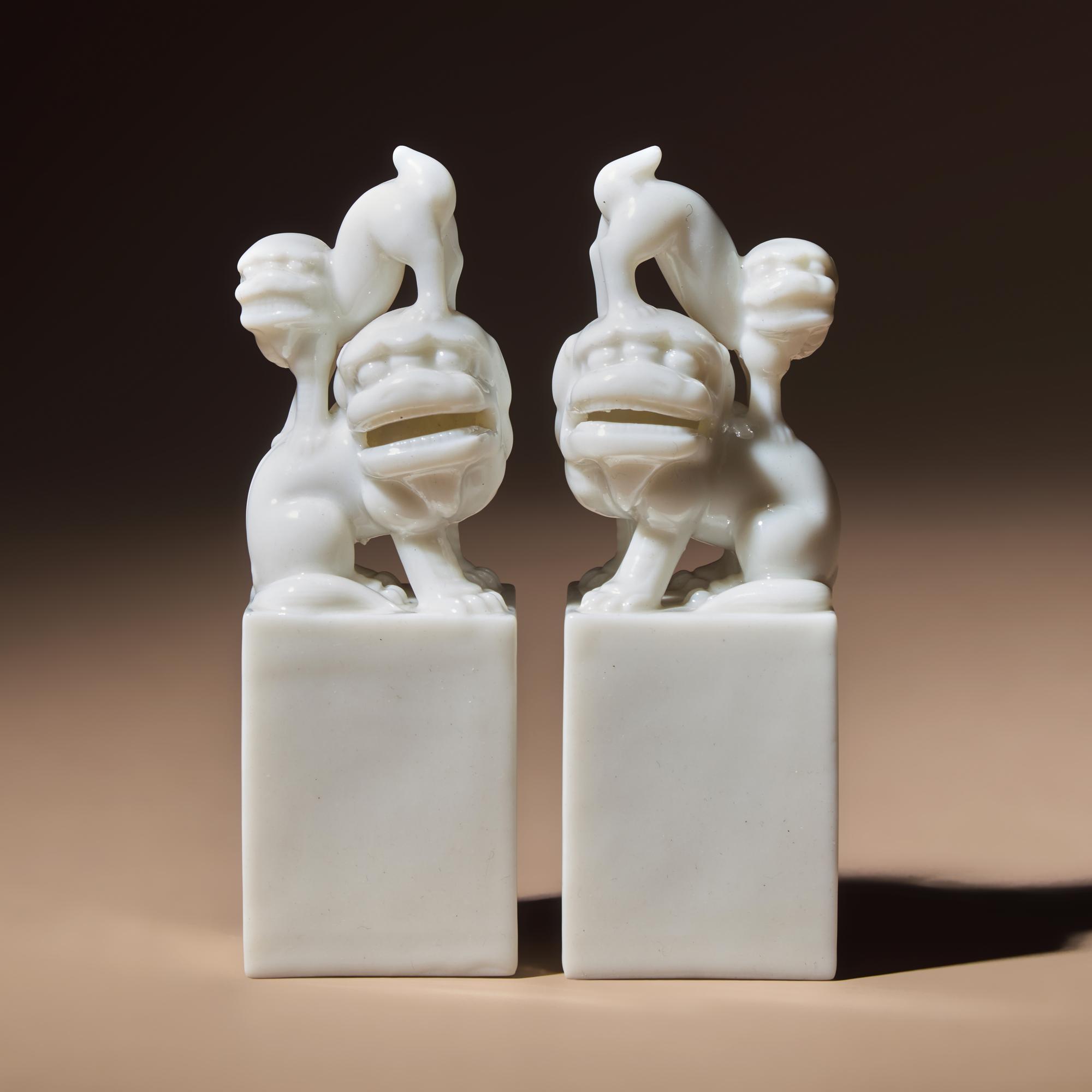 A Pair of Chinese Blanc-de-Chine Porcelain Fu Lion Seals, 18th/19th Century — 清中期 德化白瓷太獅少獅印章一對