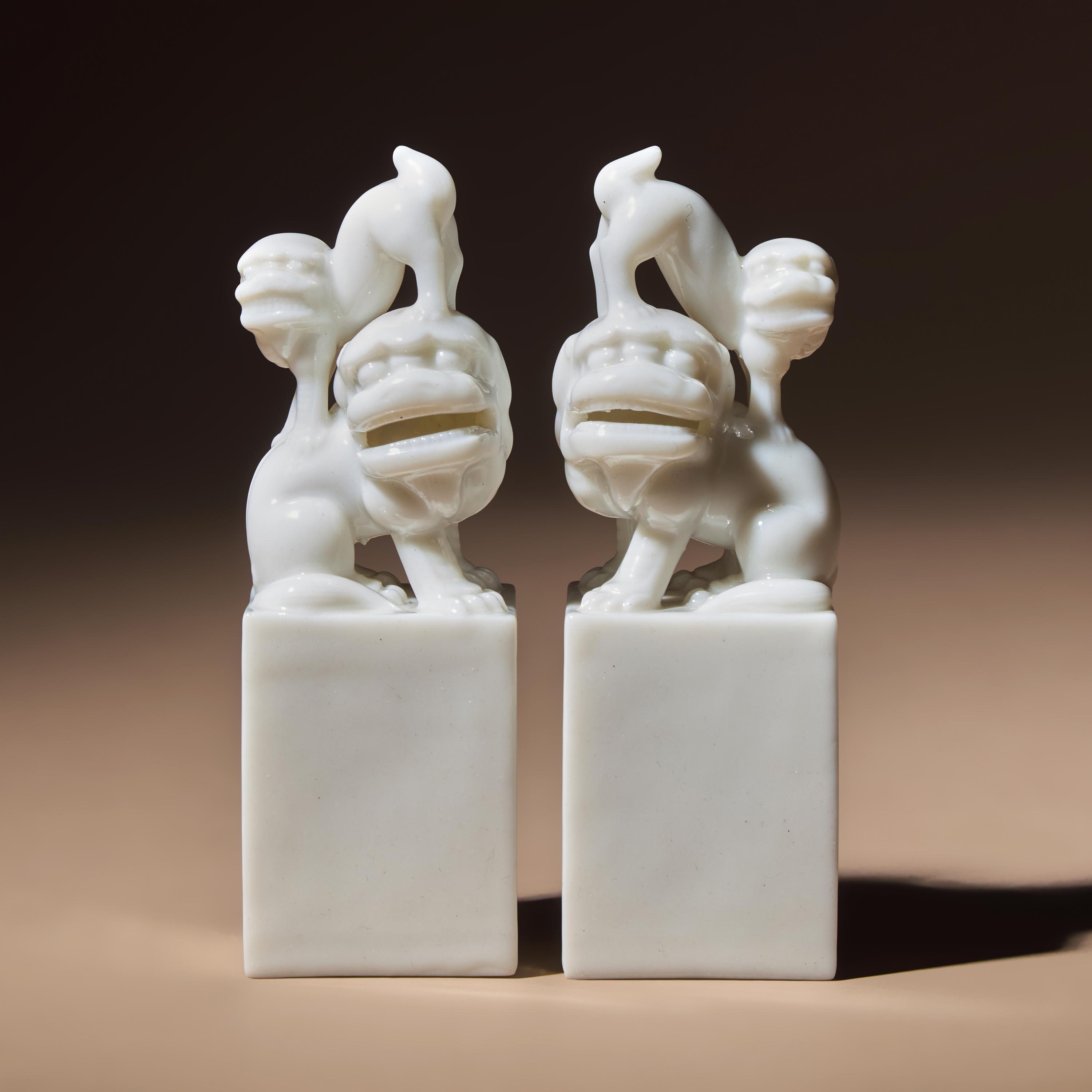 A Pair of Chinese Blanc-de-Chine Porcelain Fu Lion Seals, 18th/19th Century — 清中期 德化白瓷太獅少獅印章一對