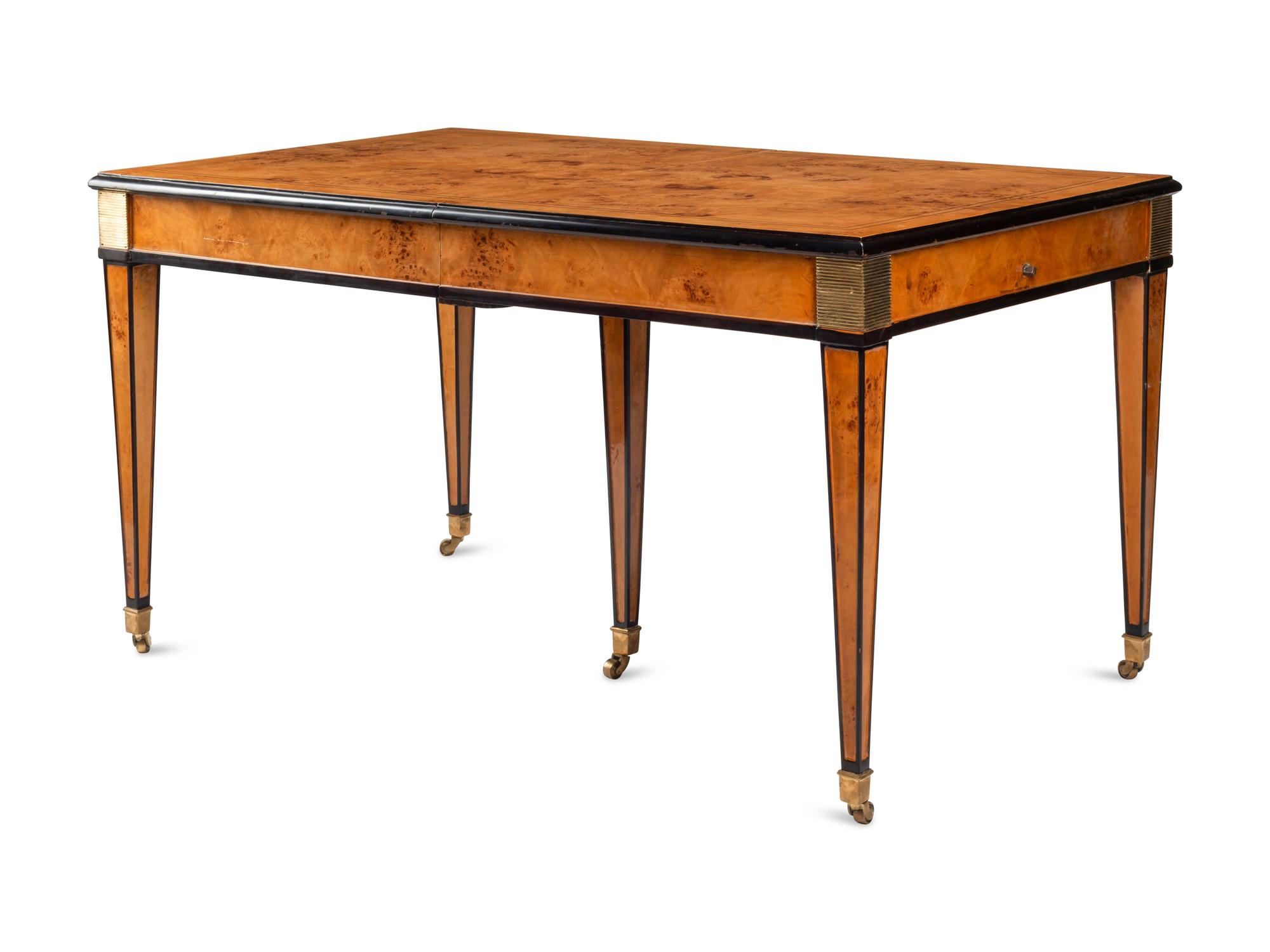 A Biedermeier Style Part Ebonized Burlwood Extending Dining Table