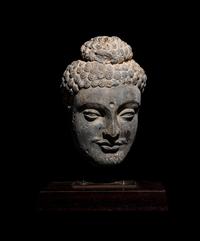 A Gandharan Grey Schist Buddha Head