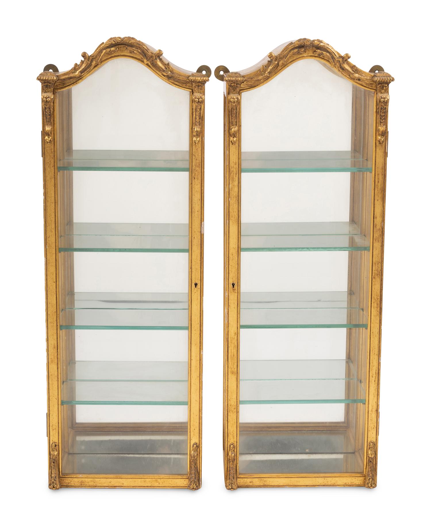 A Pair of Italian Giltwood Hanging Vitrine Cabinets
