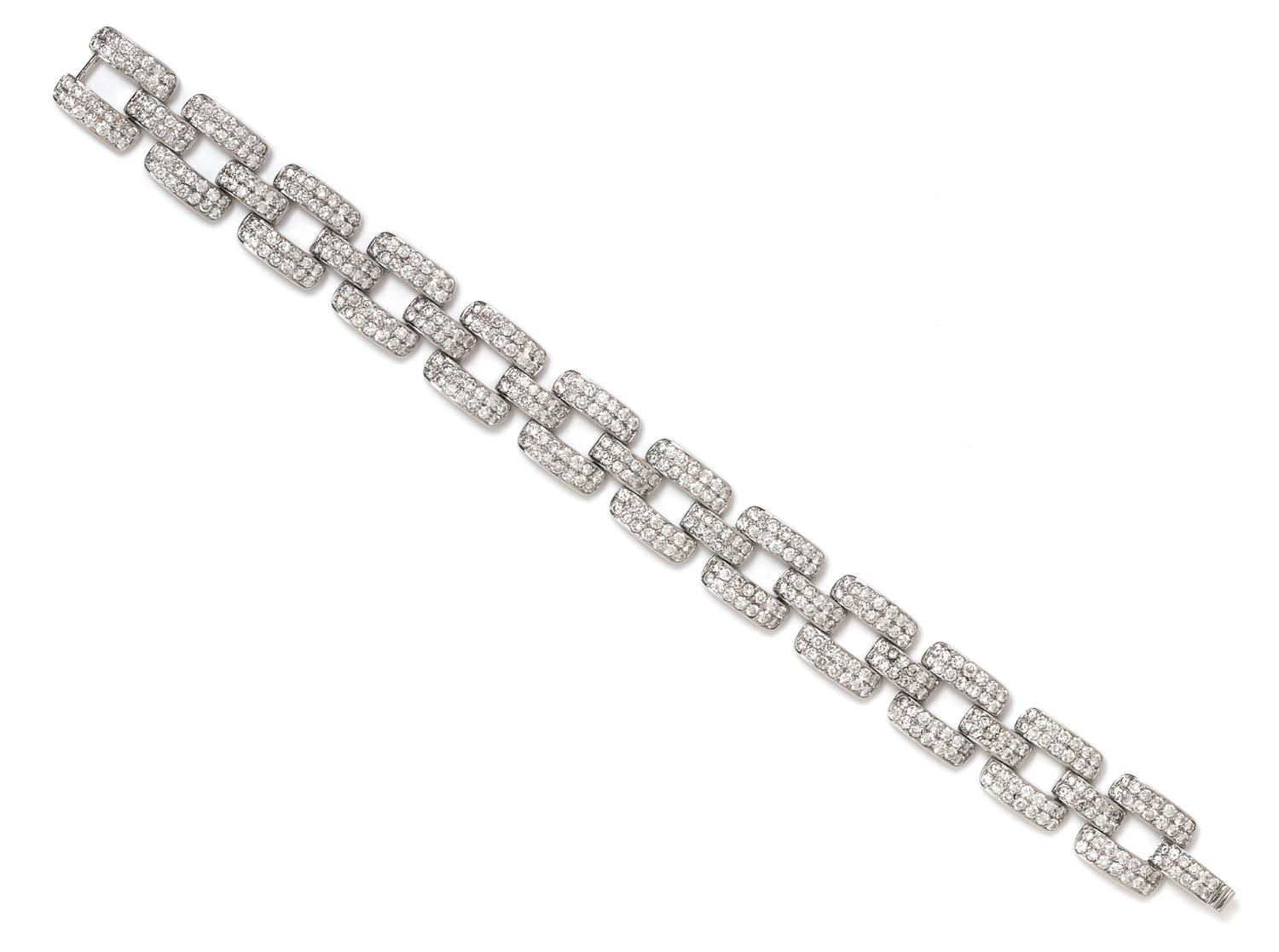 An 18 Karat White Gold and Diamond Link Bracelet, 21.40 dwts.