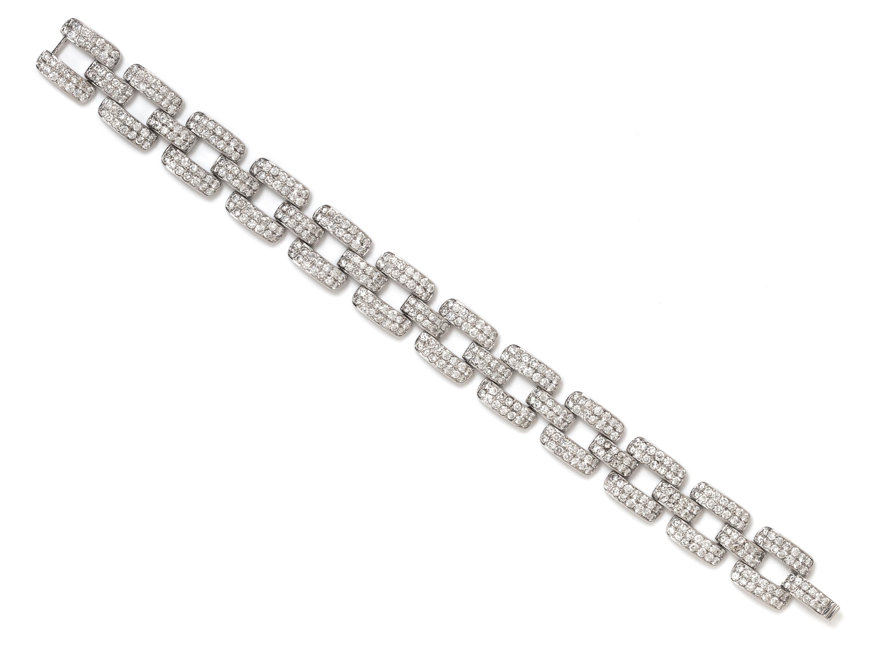 An 18 Karat White Gold and Diamond Link Bracelet, 21.40 dwts.