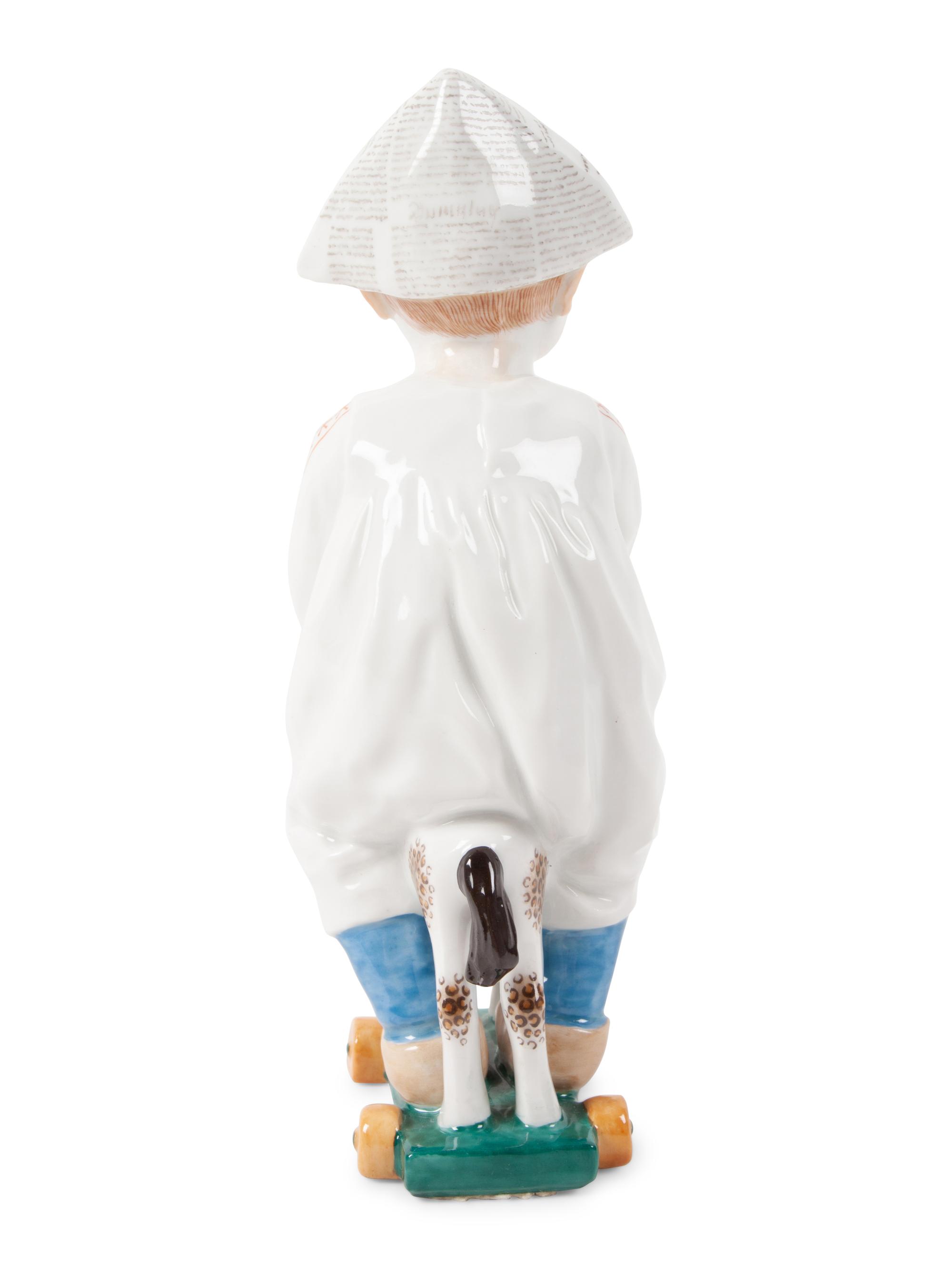 A Meissen Porcelain Figure of a Boy on a Pull Toy, by Konrad Hentschel
