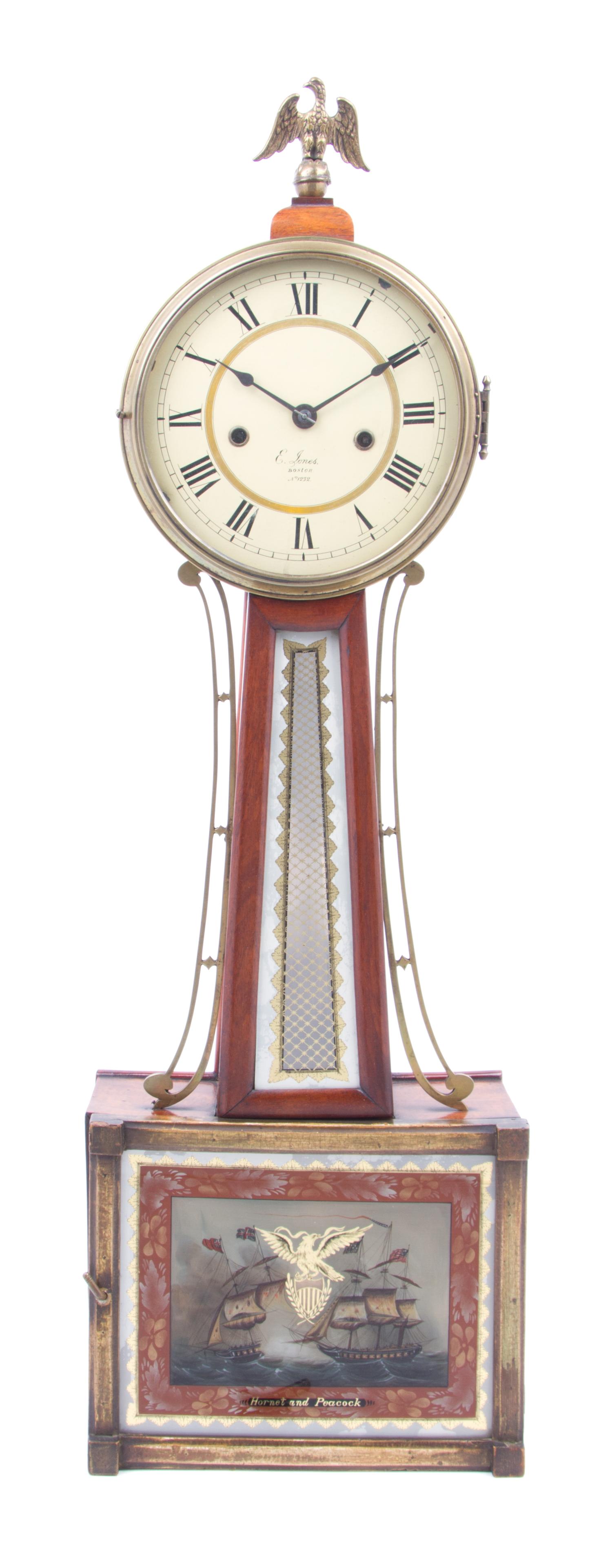 An American Walnut Banjo Clock Height 32 1/2 x width 10 x depth 3 3/4 inches. — E. JONES, BOSTON, 19TH CENTURY