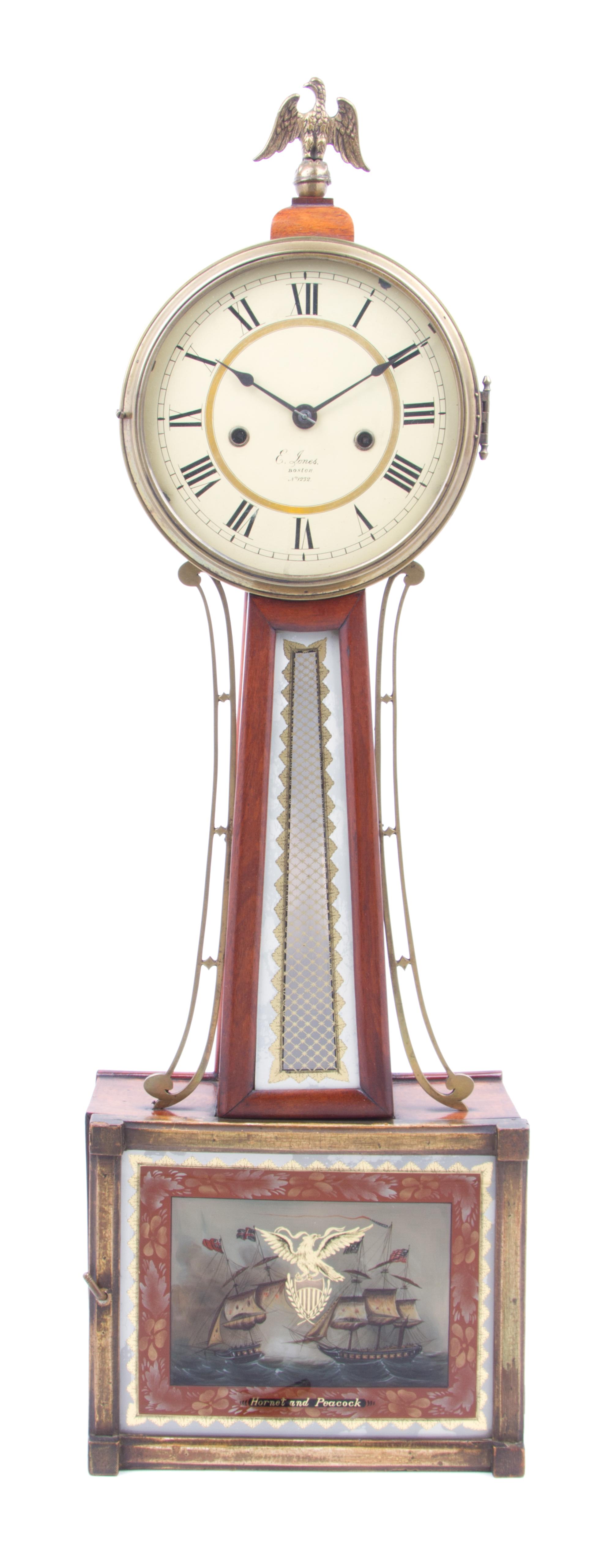 An American Walnut Banjo Clock Height 32 1/2 x width 10 x depth 3 3/4 inches. — E. JONES, BOSTON, 19TH CENTURY