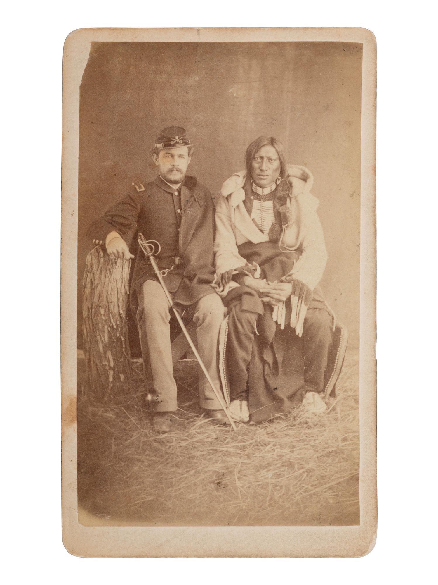 CROSS, W.R. (1839-1907), photographer. CDV of Brule Lakota Sioux Chief Hollow Horn Bear with an unidentified 5th US Cavalry second lieutenant. Niobrara, NE: [ca 1880].