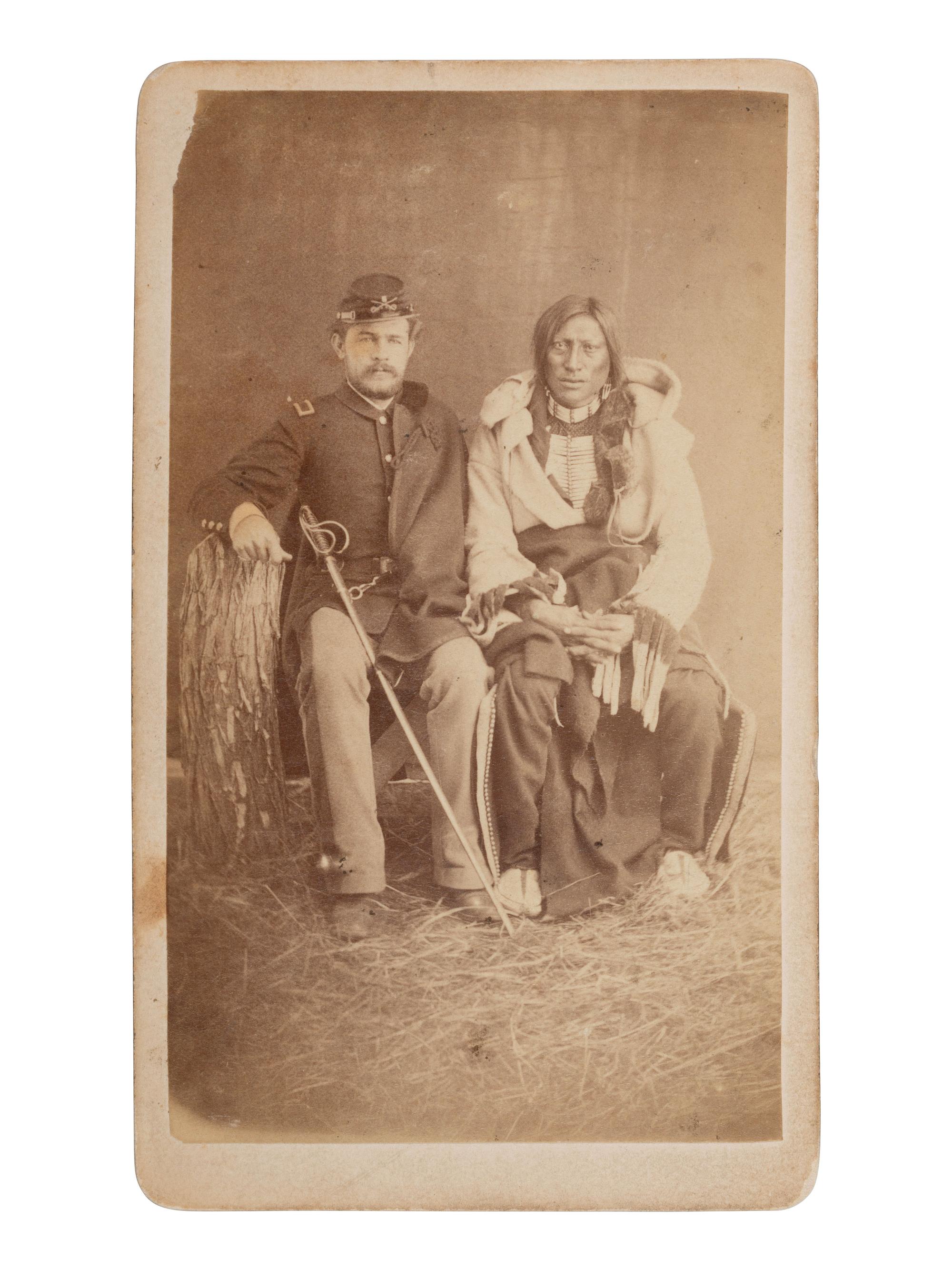CROSS, W.R. (1839-1907), photographer. CDV of Brule Lakota Sioux Chief Hollow Horn Bear with an unidentified 5th US Cavalry second lieutenant. Niobrara, NE: [ca 1880].
