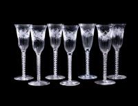 A Set of Seven Engraved Glass Cordials with Twist Stems