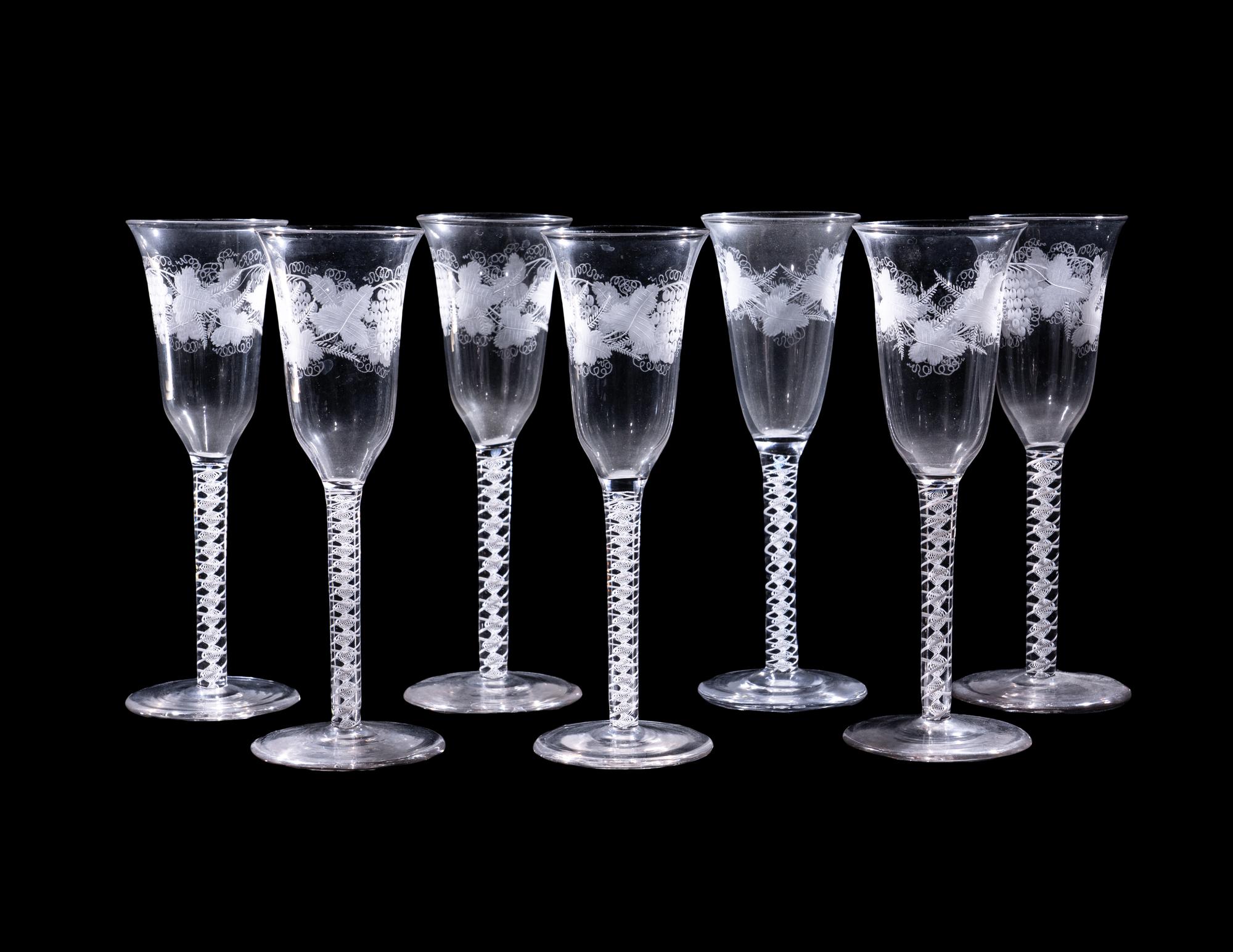 A Set of Seven Engraved Glass Cordials with Twist Stems