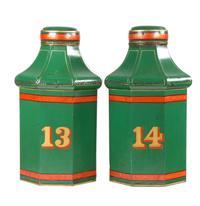 A Pair of Tole Canisters Height 23 inches.