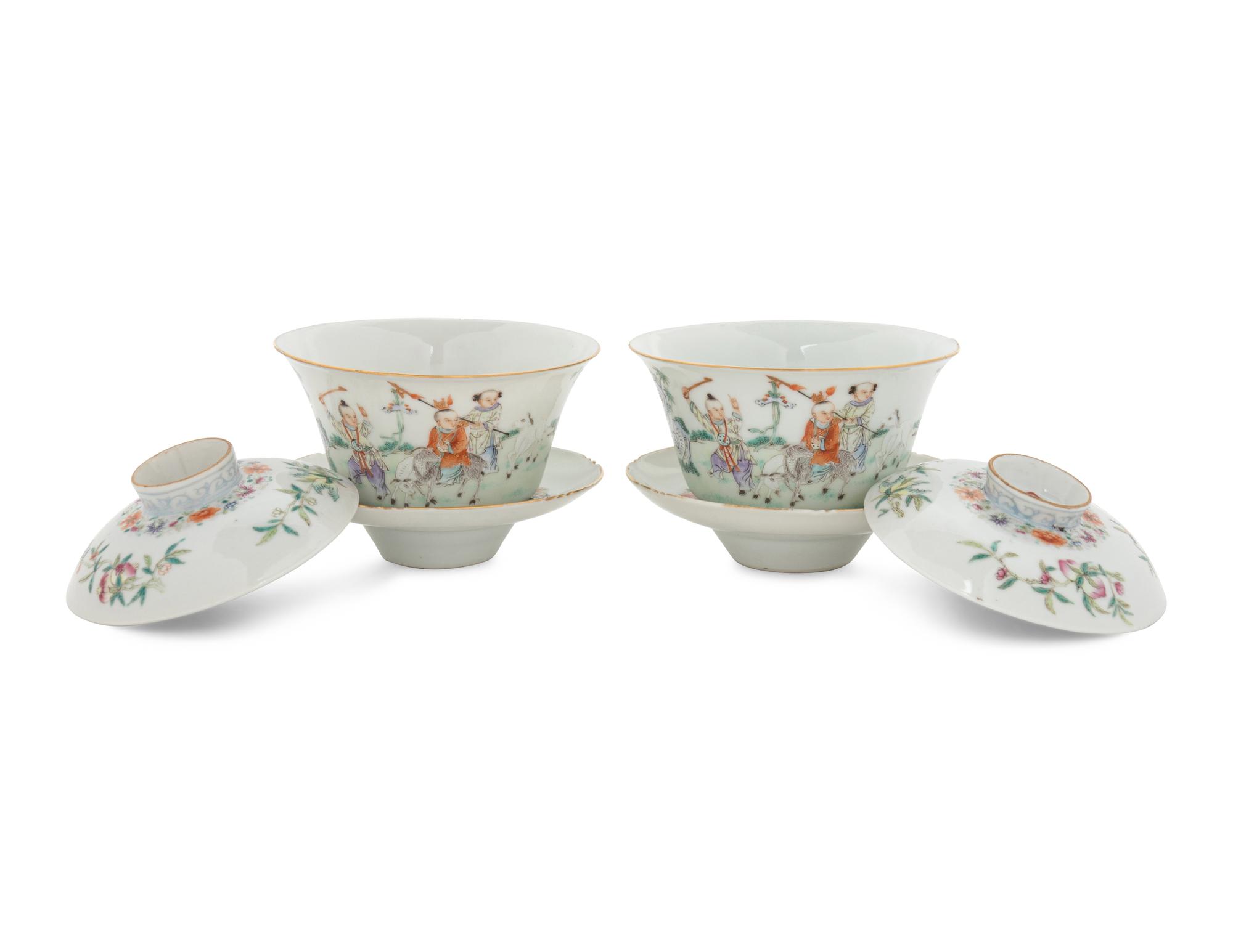 A Pair of Famille Rose Porcelain 'Boys' Covered Bowls and Stands