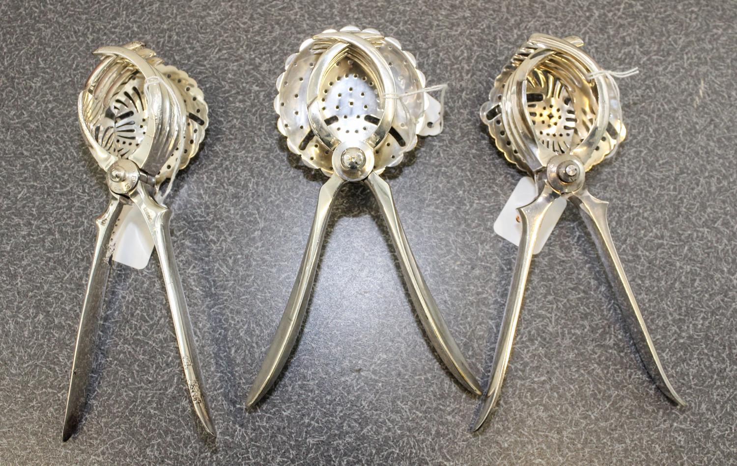 A French Silver-Plate Juice Squeeze, Christofle et Cie, Paris, 20th Century, together with two other silvered metal examples.