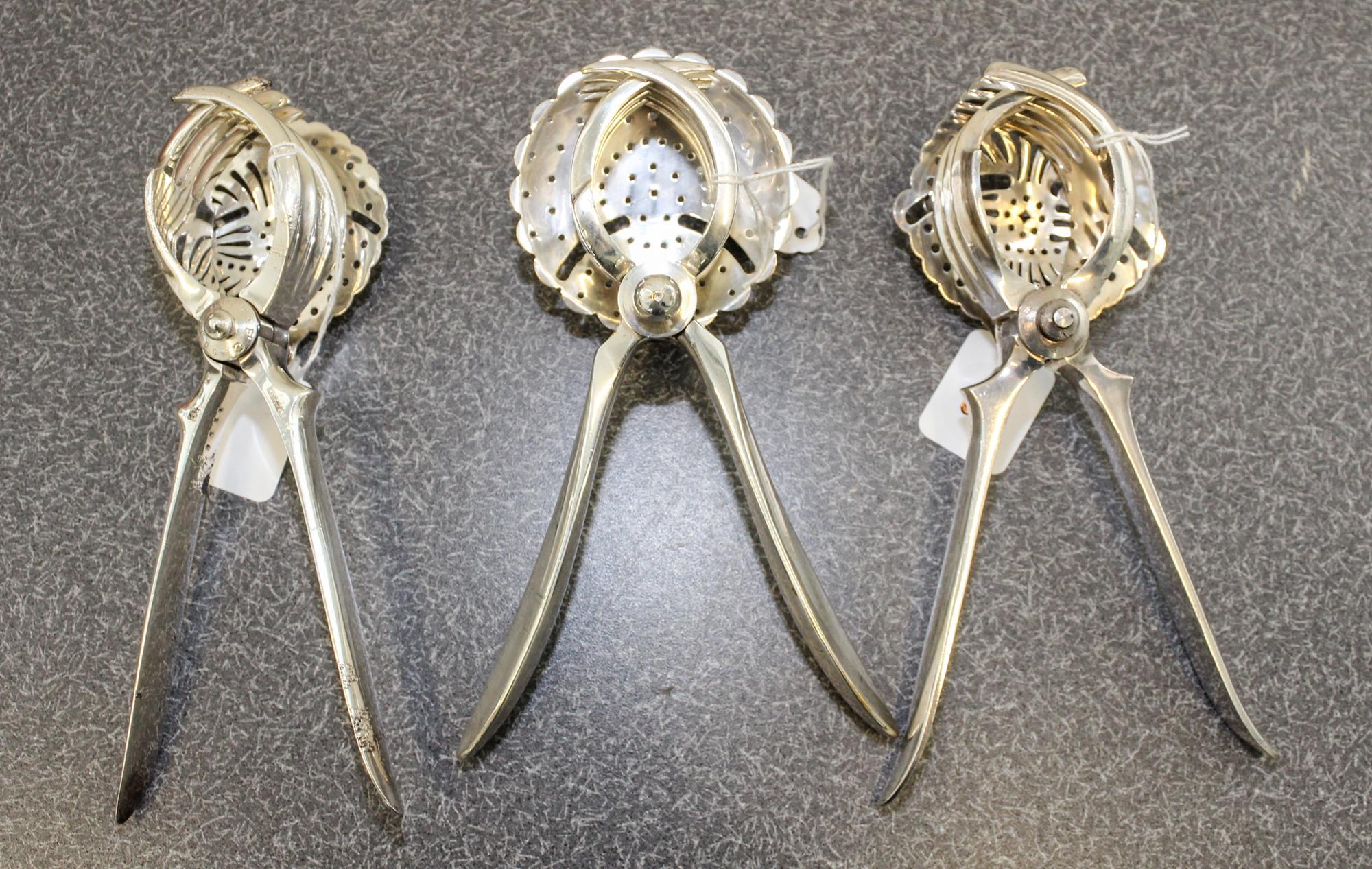 A French Silver-Plate Juice Squeeze, Christofle et Cie, Paris, 20th Century, together with two other silvered metal examples.
