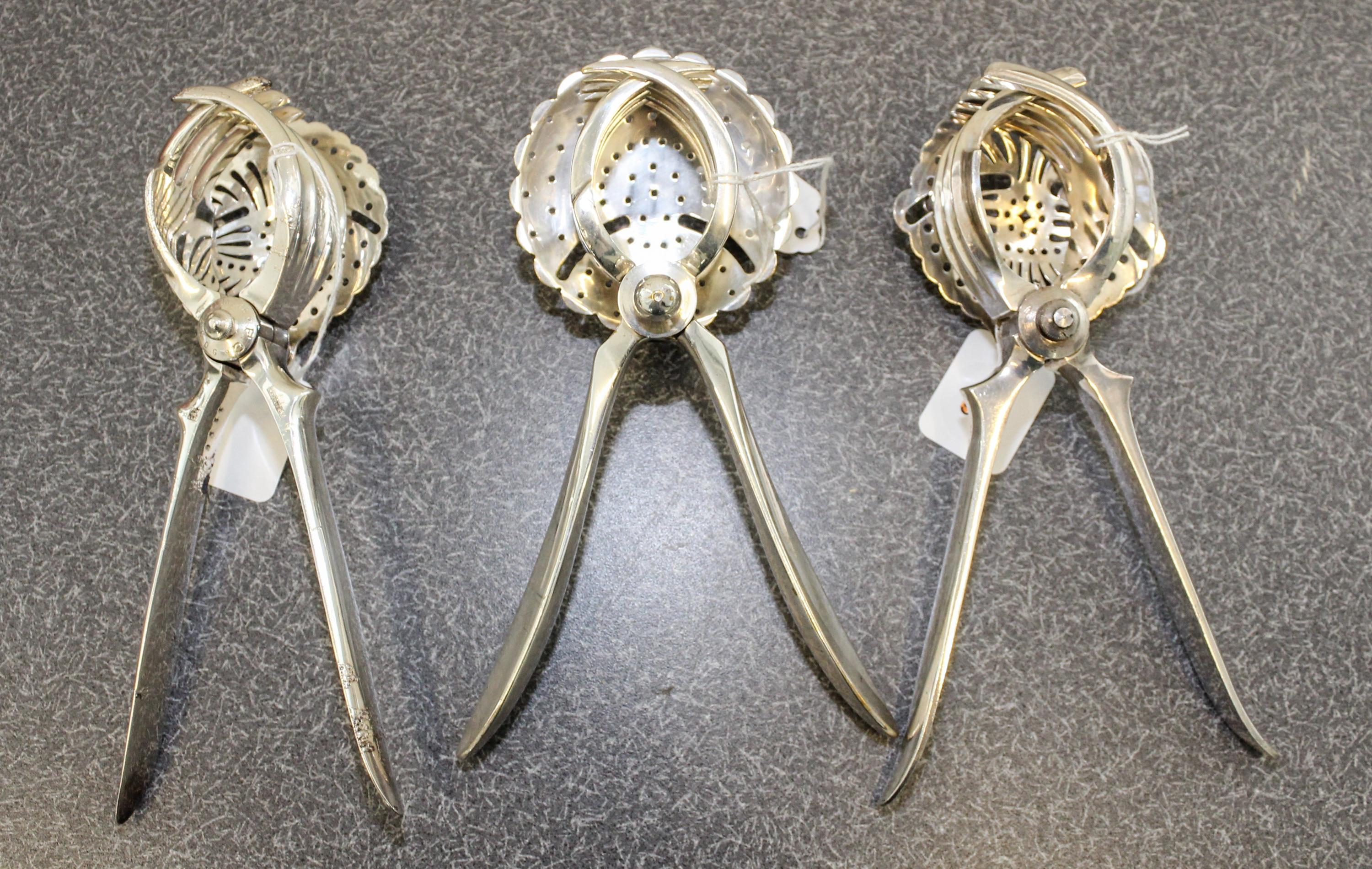 A French Silver-Plate Juice Squeeze, Christofle et Cie, Paris, 20th Century, together with two other silvered metal examples.