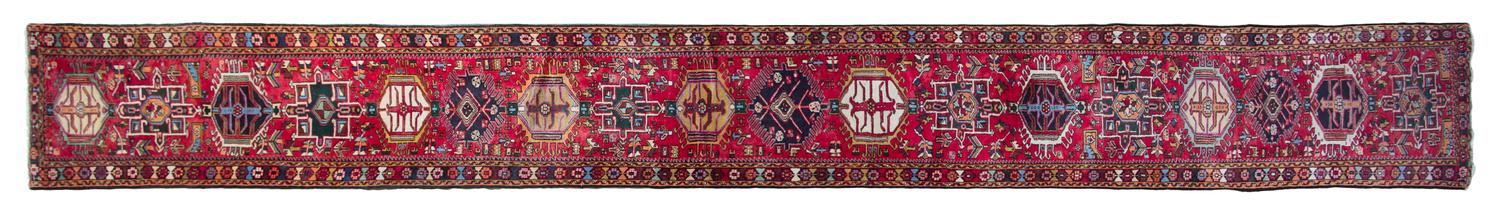 A Heriz Wool Rug 22 feet 4 inches x 2 feet 7 inches.