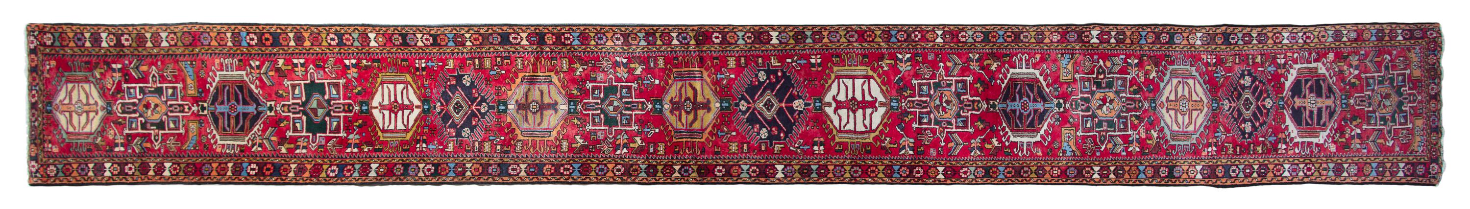 A Heriz Wool Rug 22 feet 4 inches x 2 feet 7 inches.