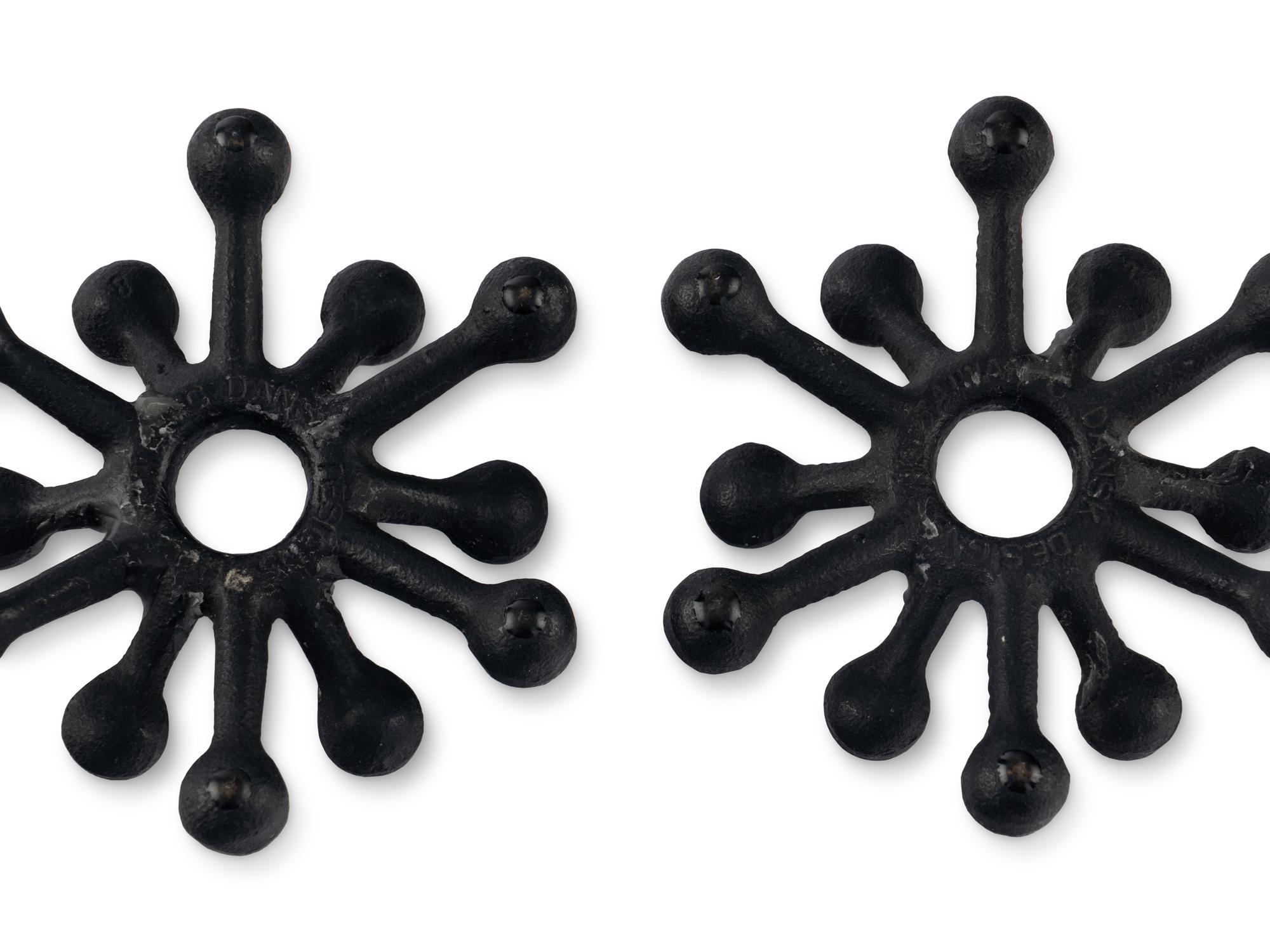 A Pair of Danish Modernist Cast Iron Candle Holders
