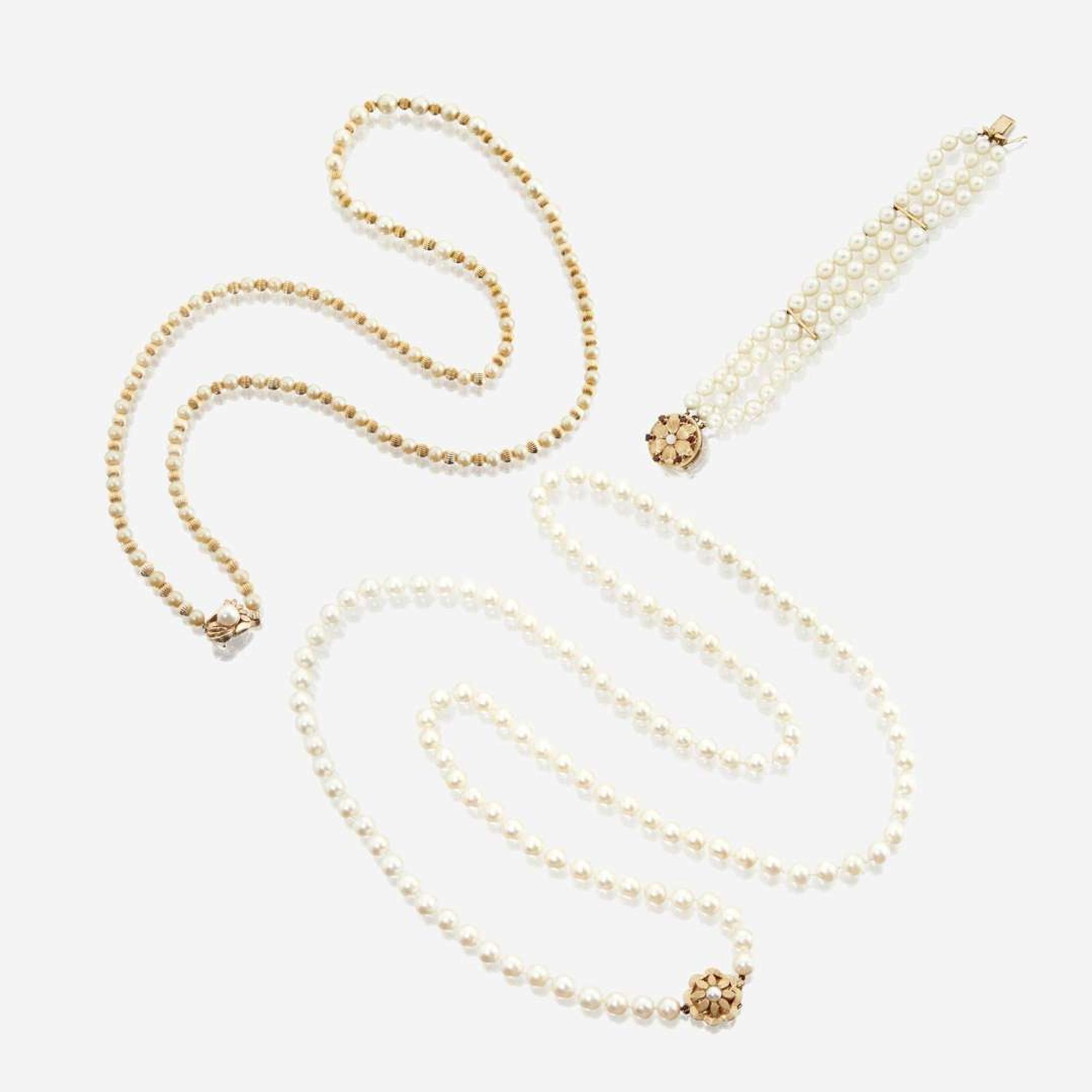 A collection of two cultured pearl necklaces and one bracelet