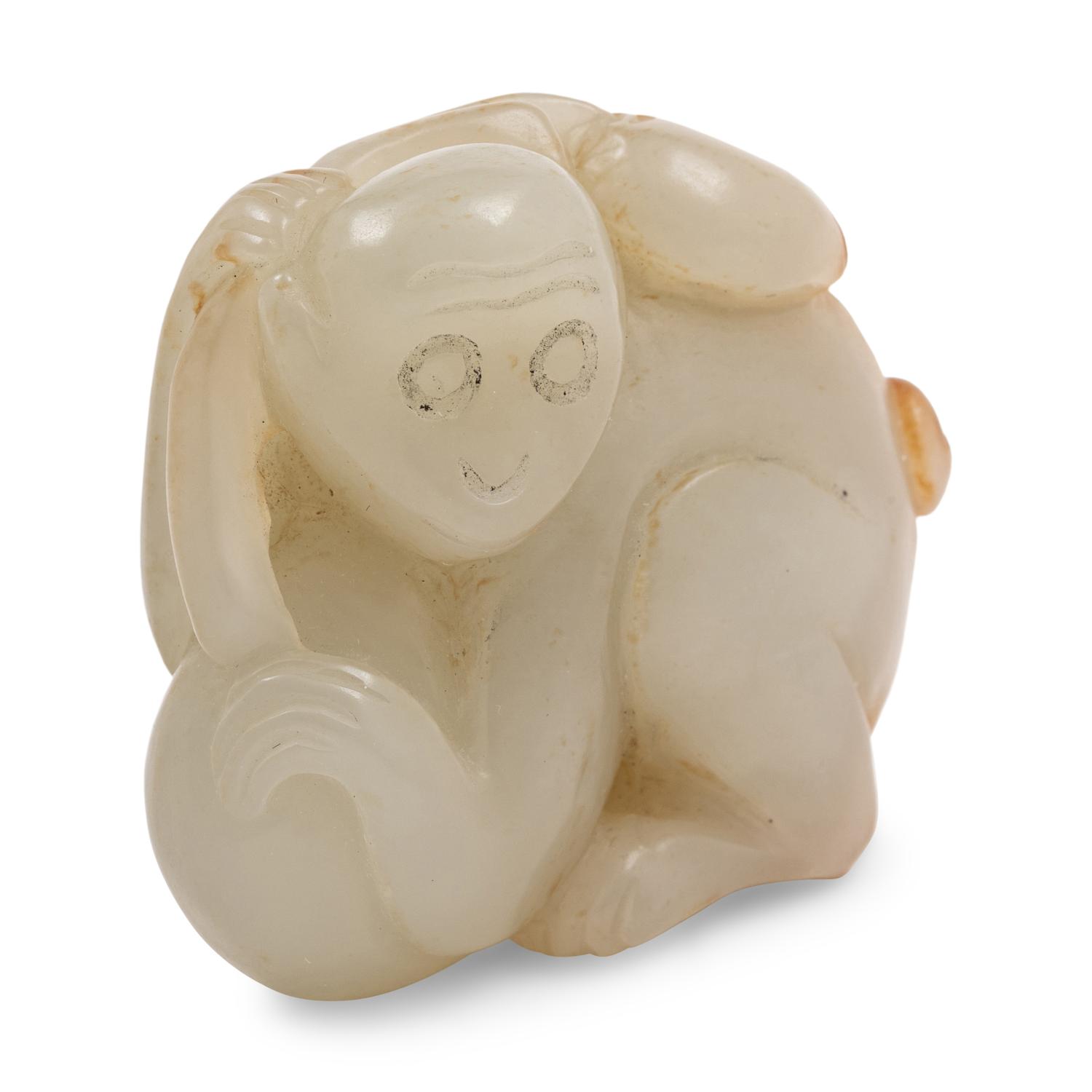 A Celadon and Russet Jade Figure of a Monkey