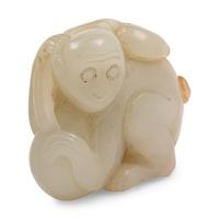 A Celadon and Russet Jade Figure of a Monkey