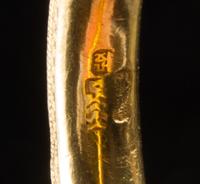 A Matched Pair of Chinese Gold Mounted Green Glass Bangles LATE QING DYNASTY Diameter: 2 inches. — LATE QING DYNASTY