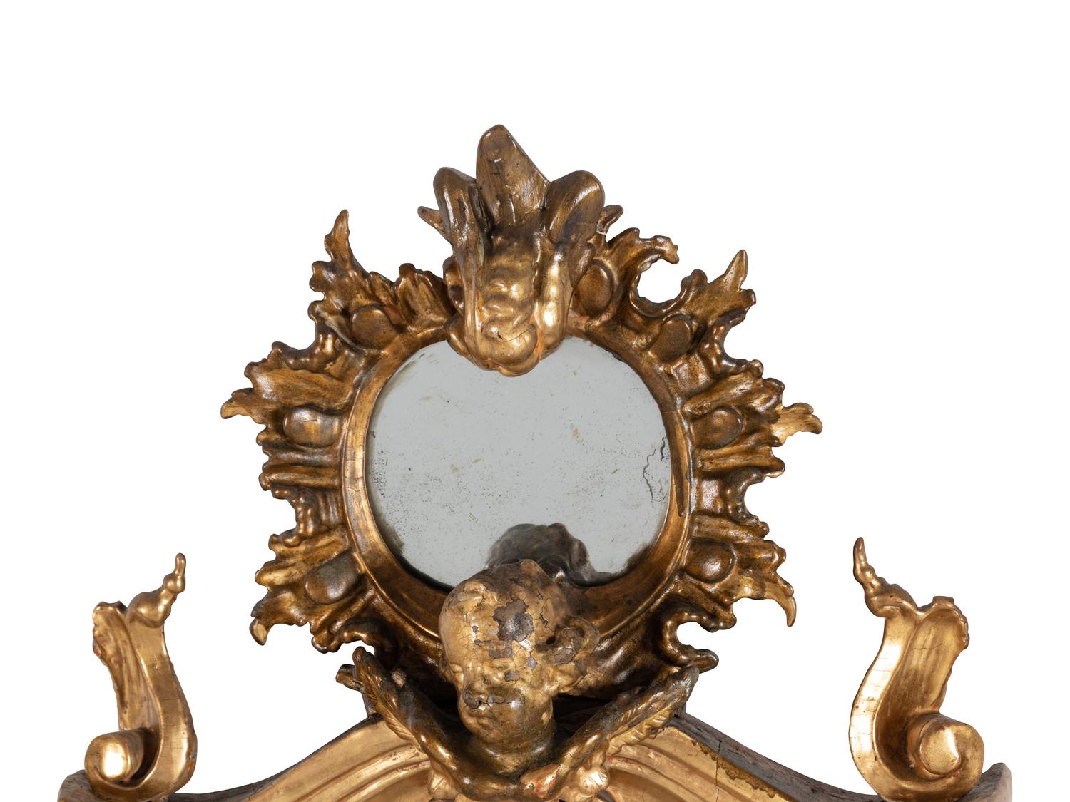 An Italian Rococo Figural Carved Giltwood Mirror