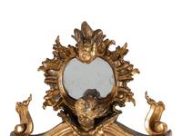 An Italian Rococo Figural Carved Giltwood Mirror