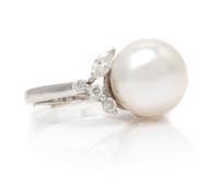 An 18 Karat White Gold, Cultured South Sea Pearl and Diamond Ring, 5.70 dwts.