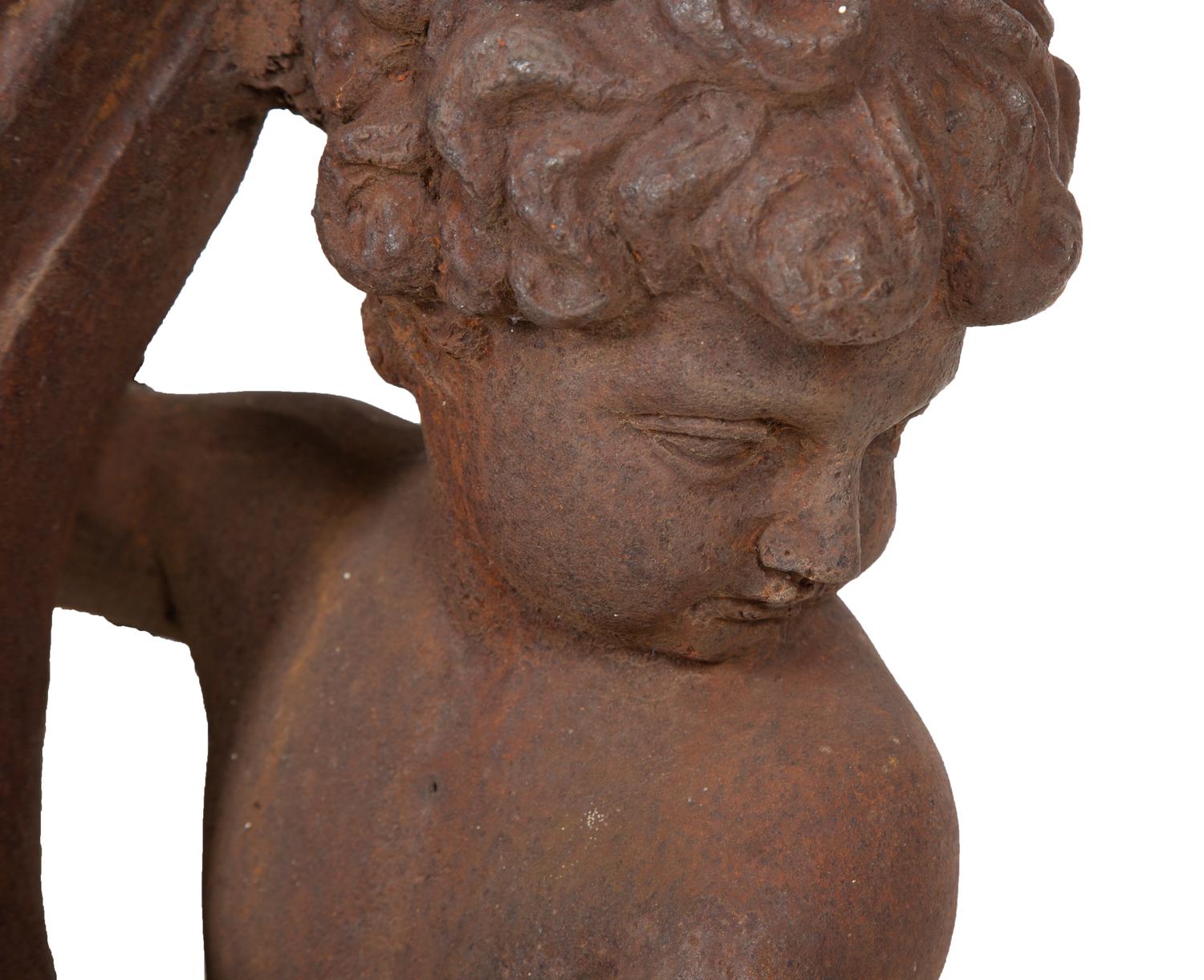 A Pair of Cast Iron Garden Cherubs