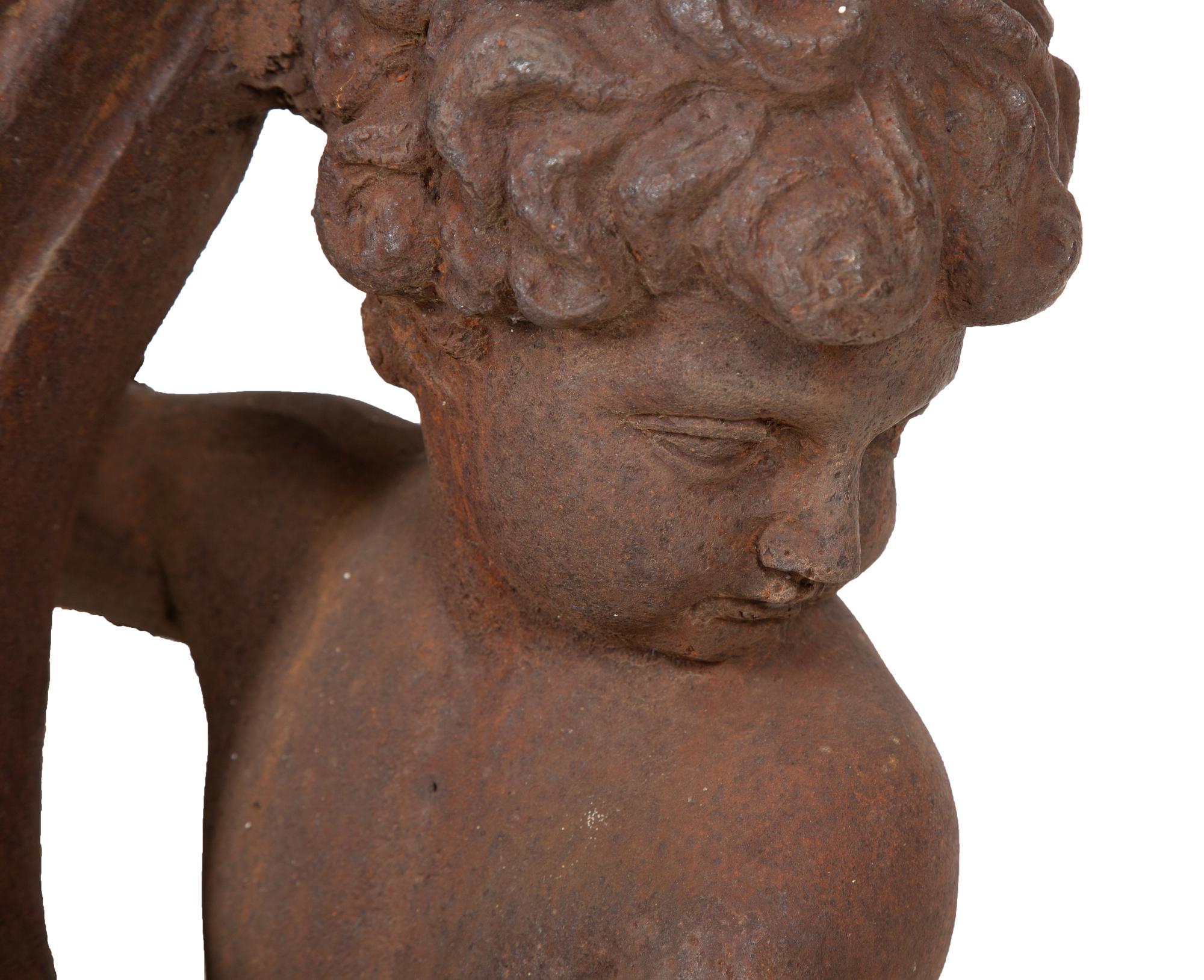 A Pair of Cast Iron Garden Cherubs