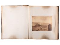 [WESTERN AMERICANA]. Album of photographs showing the construction of the "Bismarck Bridge." [Dakota Territory]: [F. Jay Haynes], [1882].