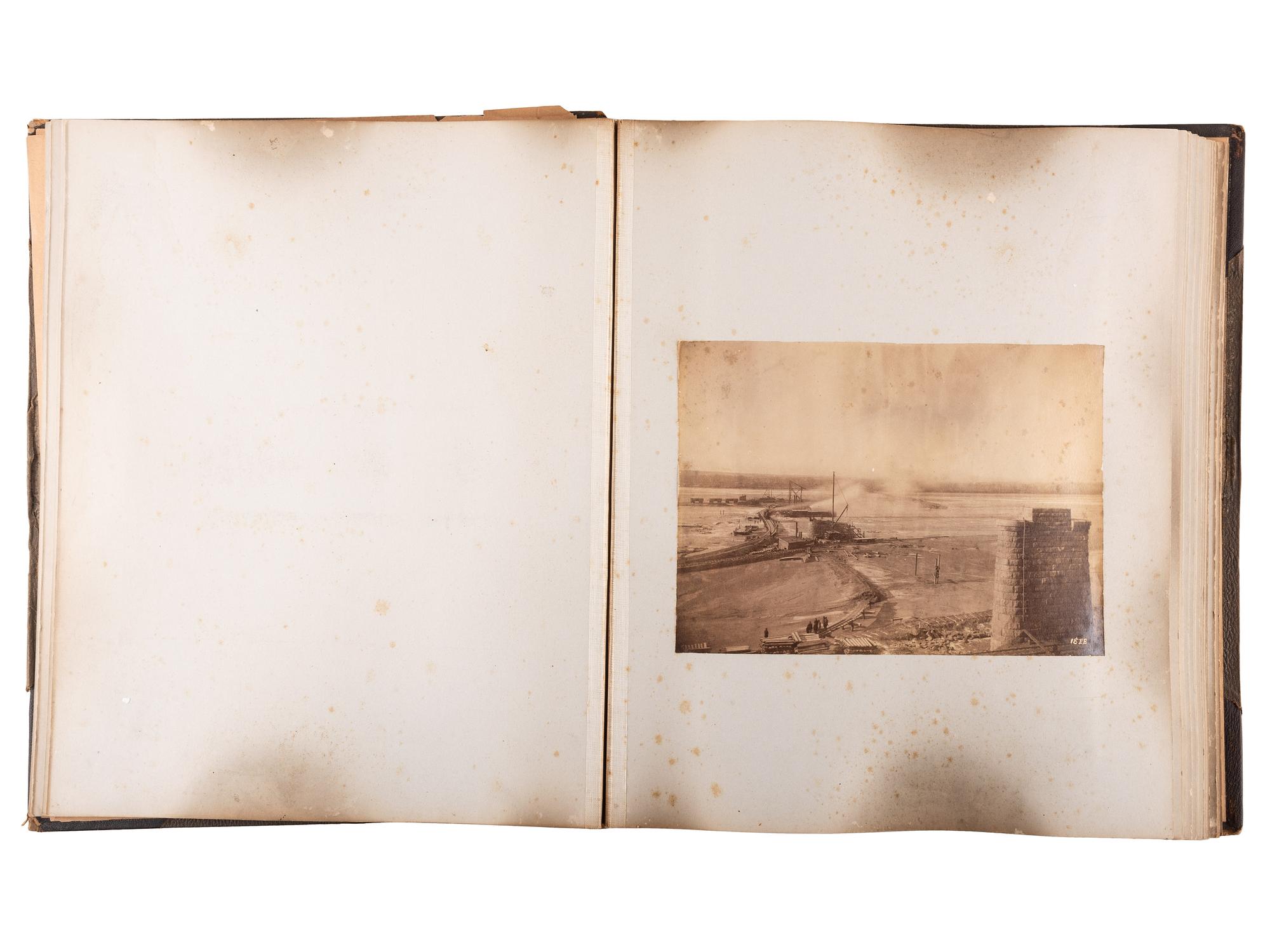 [WESTERN AMERICANA]. Album of photographs showing the construction of the "Bismarck Bridge." [Dakota Territory]: [F. Jay Haynes], [1882].