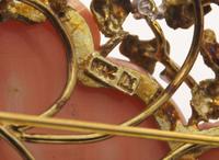 A Pair of Gold and Gemstone Brooches