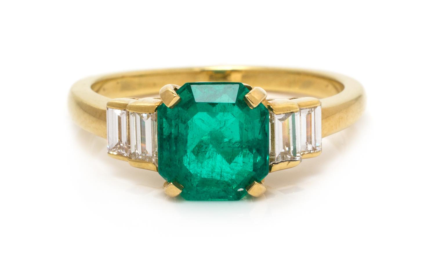 An 18 Karat Yellow Gold, Emerald and Diamond Ring, 3.20 dwts.